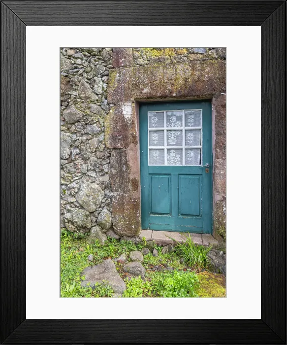 Framed Print : Aldeia da Cuada, Flores, Azores, Portugal. Blue door on a stone building