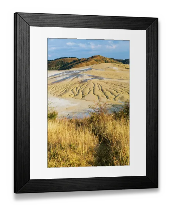 Framed Print : Romania, Buzau County, Berca. Geological, botanical reservation Vulcanii Noroiosi de la Paclele Mici. Small volcano-shaped structures caused by eruption of natural gases