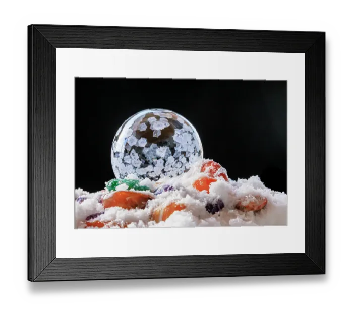 Framed Print : USA, Indiana, Carmel. Frozen soap bubble and polished stones in snow. ©Wendy Kaveney / Jaynes Gallery / DanitaDelimont.com Framed Print : USA, Indiana, Carmel. Frozen soap bubble and polished stones in snow. ©Wendy Kaveney / Jaynes Gallery / DanitaDelimont.com