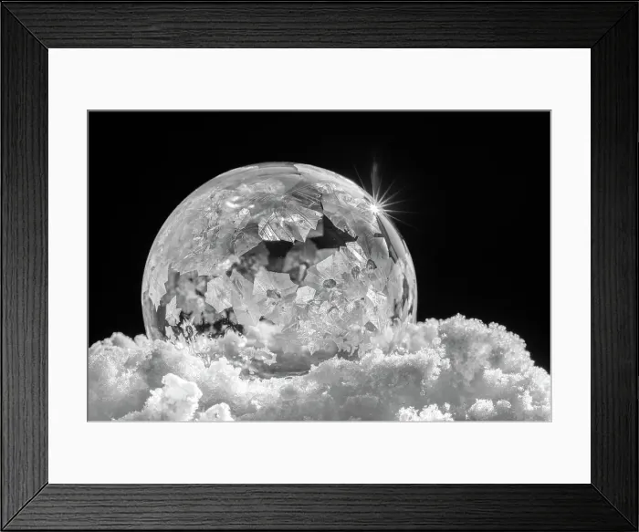 Framed Print : USA, Indiana, Carmel. Frozen soap bubble with feather-like crystals on bed of ice. ©Wendy Kaveney  /  Jaynes Gallery  /  DanitaDelimont.com