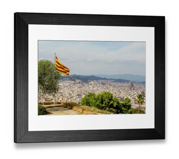 Framed Print : Catalan flag flies over the Montjuic Castle old military fortress on Montjuic Mountain overlooking the city, Barcelona, Spain