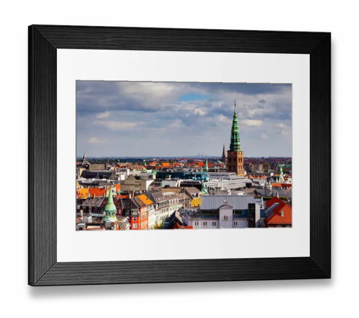 Framed Print : Christiansborg Palace tower and the Nasdaq Copenhagen, formerly known as the Copenhagen Stock Exchange tower. Oresund Bridge in distance, Copenhagen, Denmark