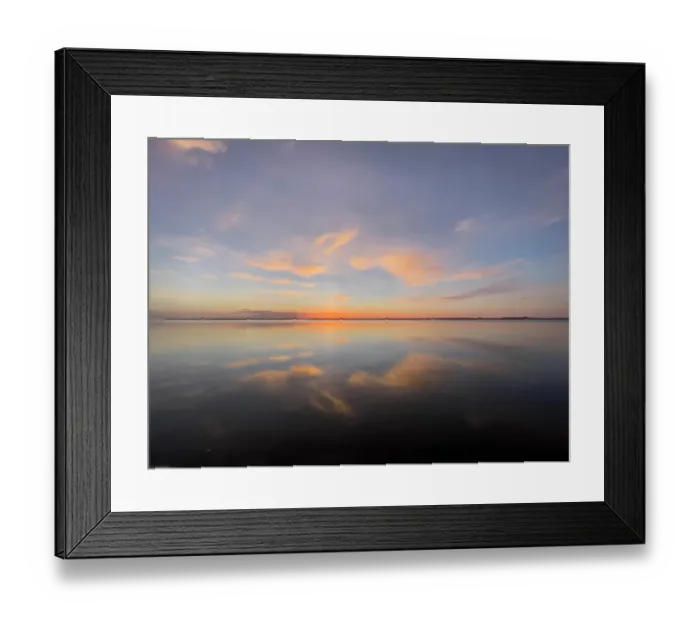 Framed Print : Sunset sky reflected on tranquil water on beach Framed Print : Sunset sky reflected on tranquil water on beach