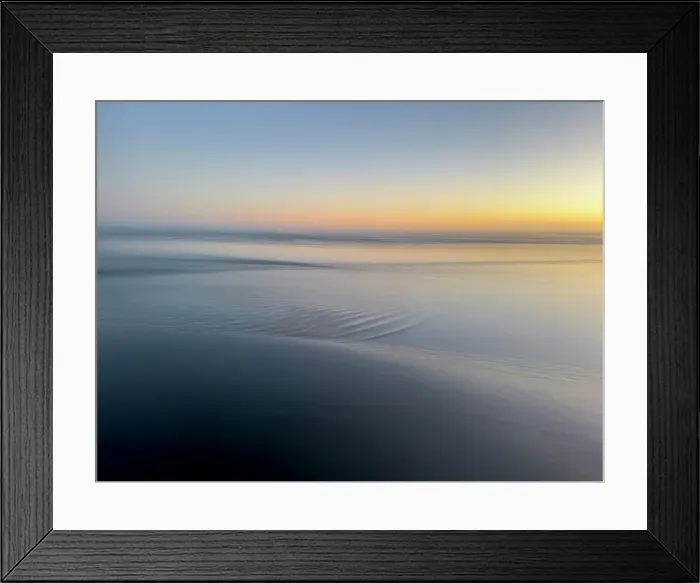 Framed Print : Abstract blur of sunset over water-covered beach