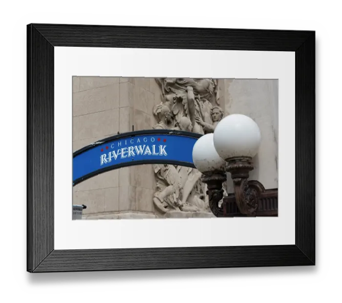 Framed Print : Riverwalk signage along the Chicago River in downtown Chicago with Michigan Avenue McCormick Bridgehouse bas-relief