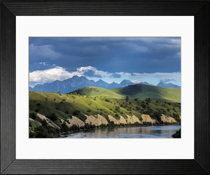 Framed Print : Clay cliffs along the Flathead River with Mission Mountains near Ronan, Montana, USA. (Editorial Use Only)