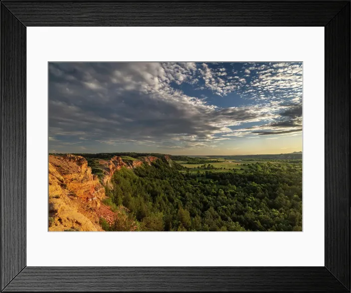 Framed Print : Days last light on the red cliffs of the Little Missouri River in the Little Missouri National Grasslands, North Dakota, USA. (Editorial Use Only) Framed Print : Days last light on the red cliffs of the Little Missouri River in the Little Missouri National Grasslands, North Dakota, USA. (Editorial Use Only)