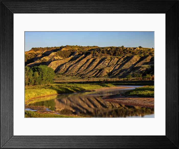 Framed Print : Cliffs reflection in the Little Missouri River at sunrise in Theodore Roosevelt National Park, North Dakota, USA. (Editorial Use Only) Framed Print : Cliffs reflection in the Little Missouri River at sunrise in Theodore Roosevelt National Park, North Dakota, USA. (Editorial Use Only)