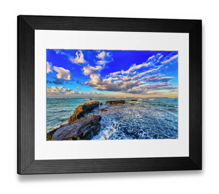 Framed Print : As the sun dips lower on the horizon, its warm, golden light can be absorbed and reflected by the black sand, intensifying the colors and creating a rich, deep contrast