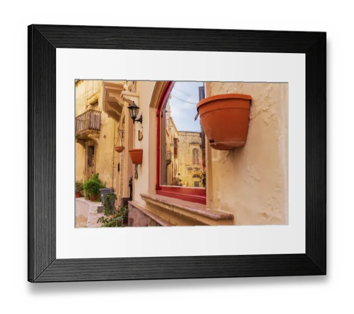 Framed Print : Malta, Birgu. Window reflection of narrow streets and stone buildings Framed Print : Malta, Birgu. Window reflection of narrow streets and stone buildings