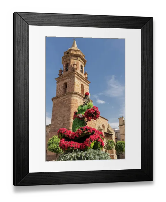 Framed Print : Andujar, Jaen Province, Andalusia, Spain. Red flowers and the bell tower of the San Miguel Church Framed Print : Andujar, Jaen Province, Andalusia, Spain. Red flowers and the bell tower of the San Miguel Church