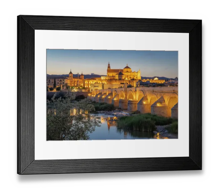 Framed Print : Sur District, Cordoba, Andalusia, Spain. Evening view of the San Rafael Bridge over the Guadalquivir River. (Editorial Use Only)