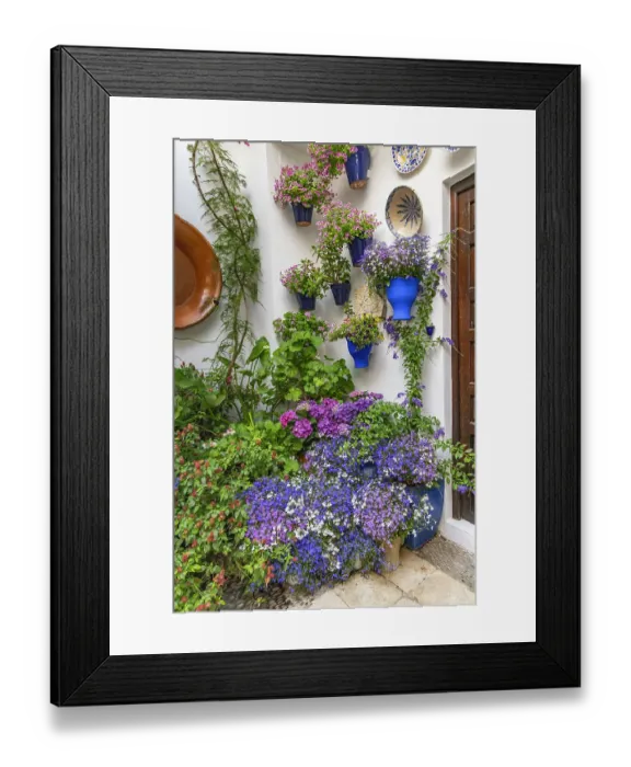 Framed Print : Centro District, Cordoba, Cordoba Province, Andalusia, Spain. May 2, 2023. Courtyard garden of a home in Cordoba. Editorial Use Only