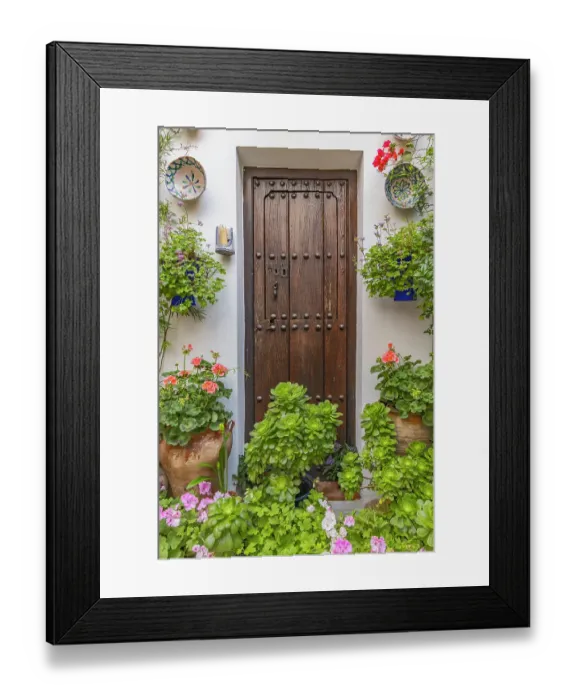 Framed Print : Centro District, Cordoba, Cordoba Province, Andalusia, Spain. May 2, 2023. Courtyard garden of a home in Cordoba. Editorial Use Only