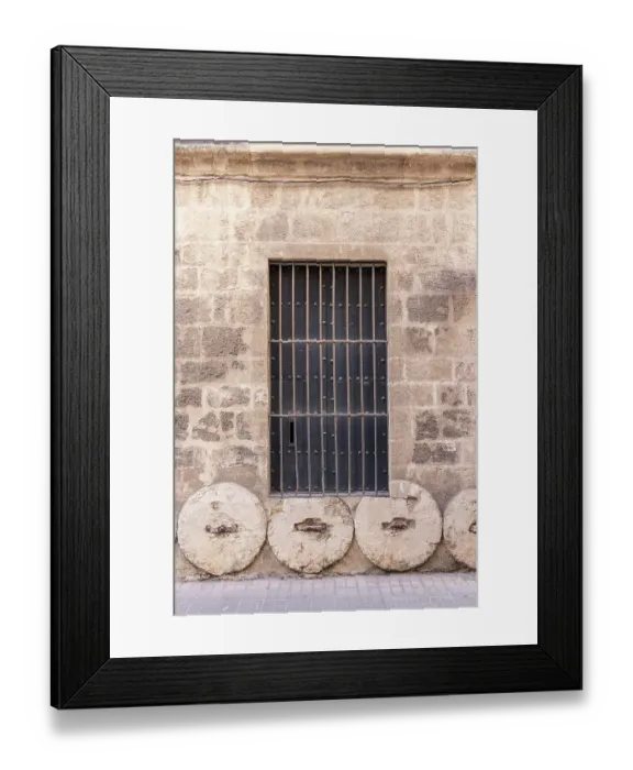 Framed Print : Casco Antiguo, Seville, Andalusia, Spain. Stone wheels being used in the foundation of an old Spanish building Framed Print : Casco Antiguo, Seville, Andalusia, Spain. Stone wheels being used in the foundation of an old Spanish building