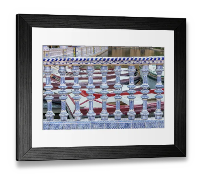 Framed Print : Casco Antiguo, Seville, Andalusia, Spain. Rowboats behind a ceramic banister at the canal in the Spanish Plaza of Seville Framed Print : Casco Antiguo, Seville, Andalusia, Spain. Rowboats behind a ceramic banister at the canal in the Spanish Plaza of Seville
