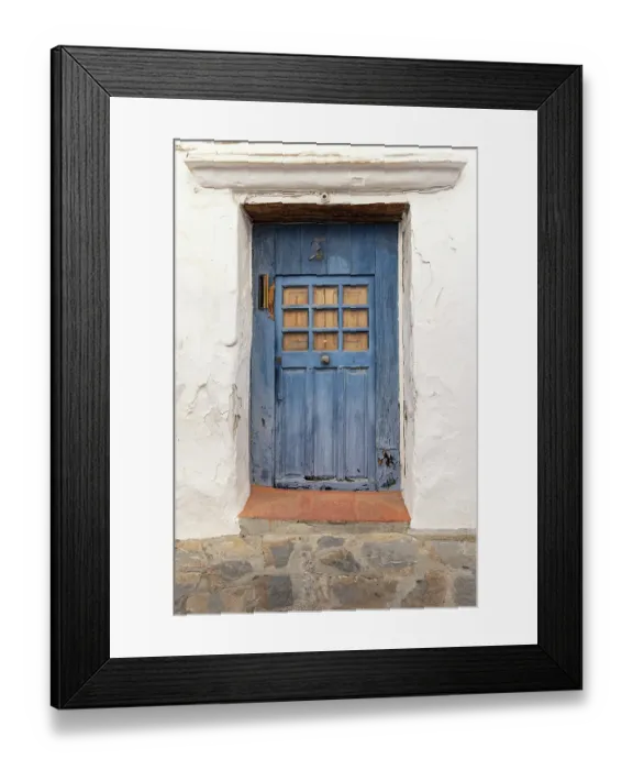 Framed Print : Casares, Malaga, Andalusia, Spain. A weather blue door on a white stucco house Framed Print : Casares, Malaga, Andalusia, Spain. A weather blue door on a white stucco house