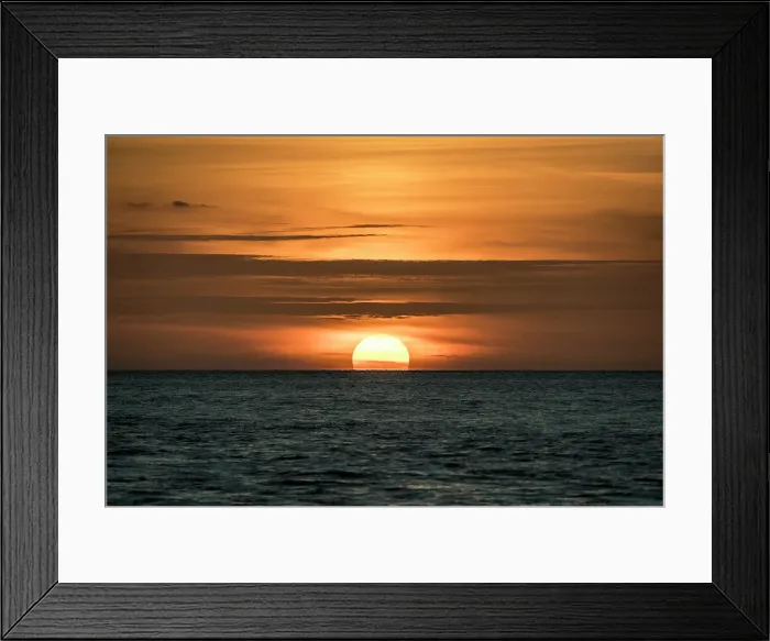 Framed Print : Sun sets amid light clouds in the Gulf of Mexico