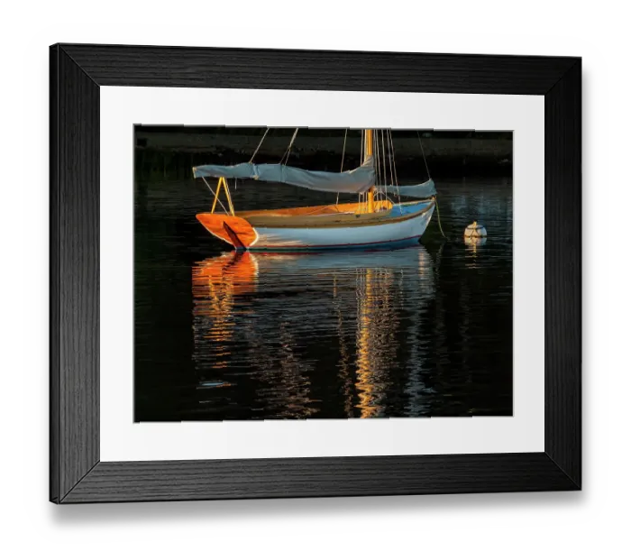 Framed Print : USA, Massachusetts, Cape Cod, Falmouth. Vintage sailboat moored in Quissett Harbor at sunset Framed Print : USA, Massachusetts, Cape Cod, Falmouth. Vintage sailboat moored in Quissett Harbor at sunset