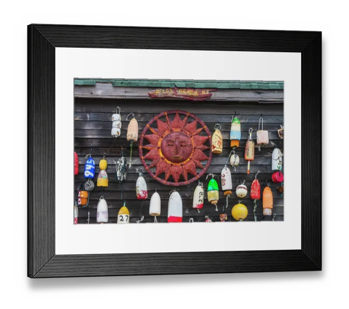 Framed Print : USA, New Jersey. Fishing floats and sun disc as wall decorations Framed Print : USA, New Jersey. Fishing floats and sun disc as wall decorations