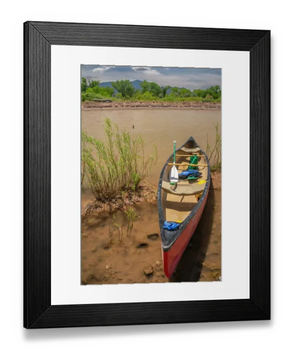 Framed Print : USA, New Mexico, Rio Grande River. Empty canoe on riverbank