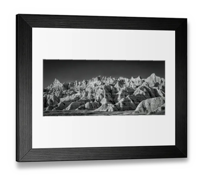 Framed Print : The wind and water eroded landscape in the Badlands National Park seem desolate but make for beautiful natural carvings. USA Framed Print : The wind and water eroded landscape in the Badlands National Park seem desolate but make for beautiful natural carvings. USA