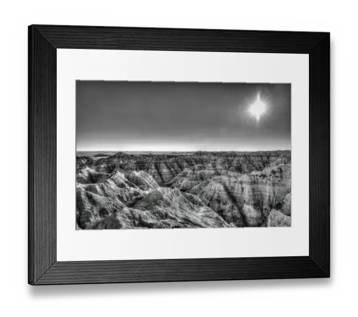 Framed Print : The wind and water eroded landscape in the Badlands National Park seem desolate but make for beautiful natural carvings. USA Framed Print : The wind and water eroded landscape in the Badlands National Park seem desolate but make for beautiful natural carvings. USA