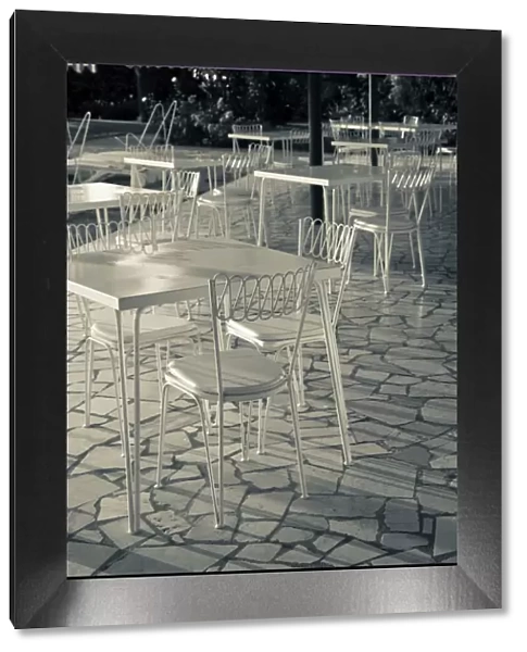 Italy, Brescia Province, Sirmione. Lakeside cafe tables
