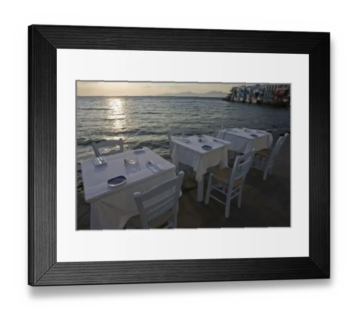 Framed Print : Greece, Mykonos, Hora. Three dinner tables overlooking the sea at sunset. Credit as Framed Print : Greece, Mykonos, Hora. Three dinner tables overlooking the sea at sunset. Credit as