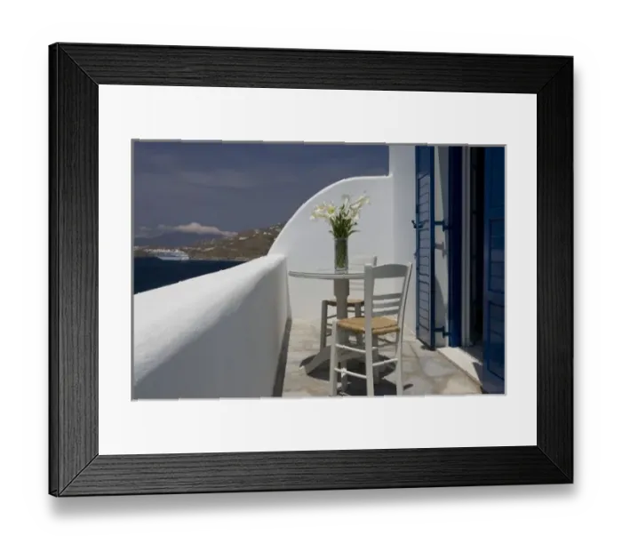 Framed Print : Greece, Mykonos, Hora. Balcony table and chairs with a docked cruise ship in the distance Framed Print : Greece, Mykonos, Hora. Balcony table and chairs with a docked cruise ship in the distance