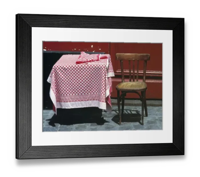 Framed Print : Europe, France, Paris. A sidewalk table for one welcomes a diner in the Montmartre Framed Print : Europe, France, Paris. A sidewalk table for one welcomes a diner in the Montmartre