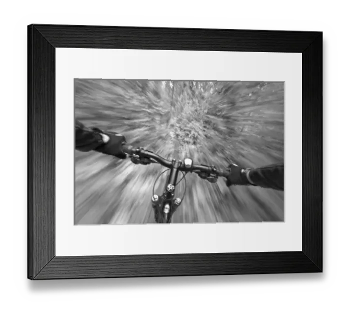 Framed Print : Cruising down a buff section of singletrack trail from the riders perspective near