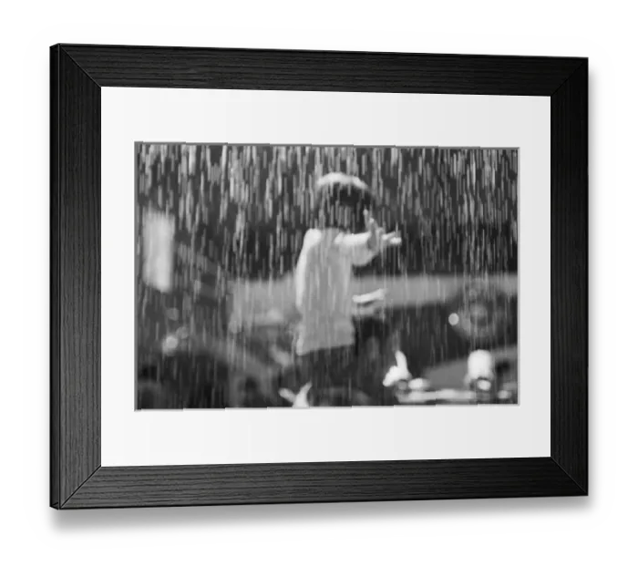 Framed Print : Europe, Switzerland, Geneva. Geneva Motor Show; girl and artificail rain at the Saab exhibit