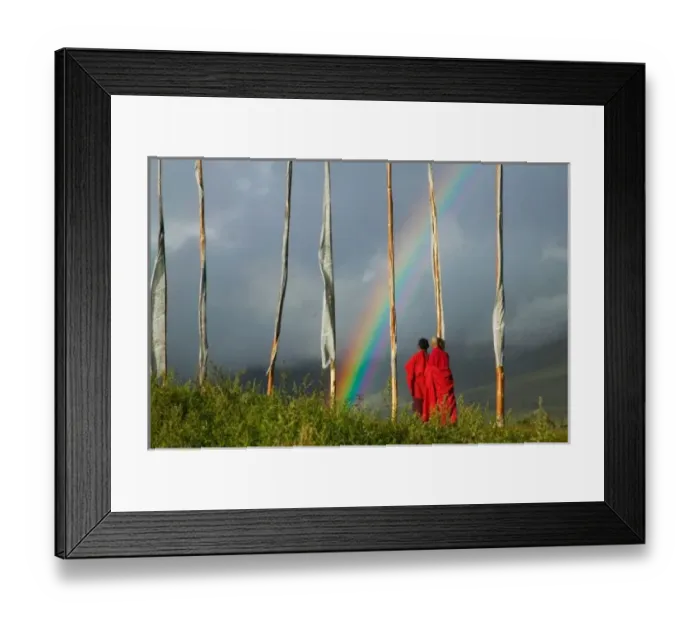 Framed Print : Bhutan, Gangtey village, Rainbow over two monks with praying flags in the Phobjikha Valley