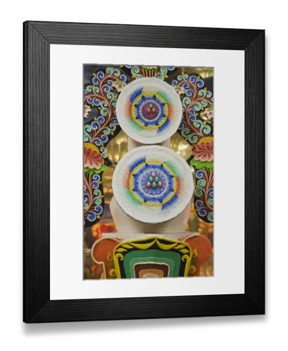 Framed Print : Bhutan. Ceremonial cakes made by monks adorn the altar in a Buddhist temple