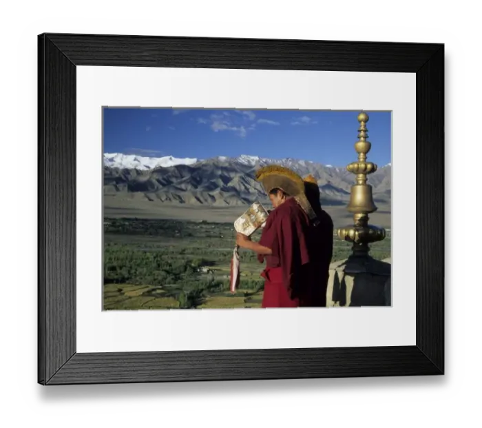 Framed Print : India, Ladakh, Thikse. Buddhist monk blows conch horn announcing prayers from rooftop Framed Print : India, Ladakh, Thikse. Buddhist monk blows conch horn announcing prayers from rooftop