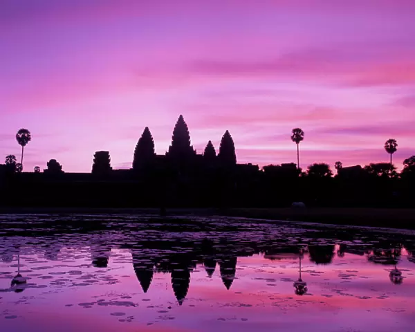 Asia, Cambodia, Siem Reap, Angkor Wat (b. 12th century). View of temple at dawn