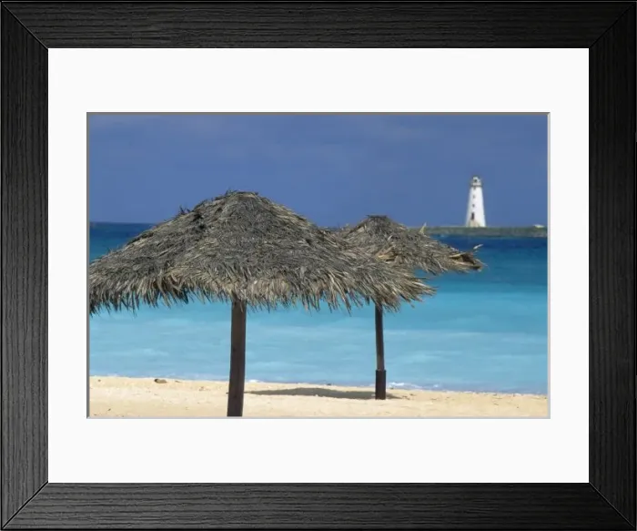 Framed Print : Caribbean, Bahamas, Nassau Harbor. Lighthouse and thatch palapa