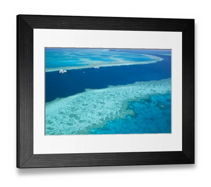Framed Print : Aerial view of The Great Barrier Reef by the Whitsunday Coast with diving boats anchored Framed Print : Aerial view of The Great Barrier Reef by the Whitsunday Coast with diving boats anchored