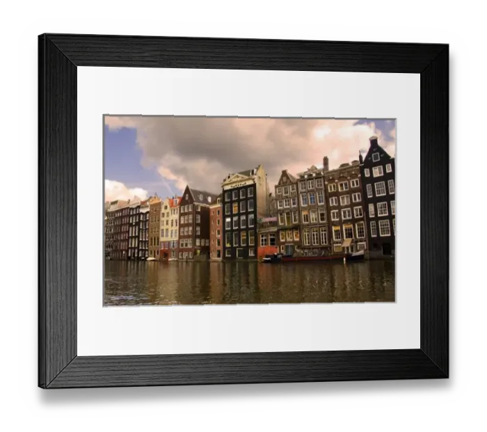 Framed Print : View of the unique architecture and gabled homes and coffee shop along a colorful canal