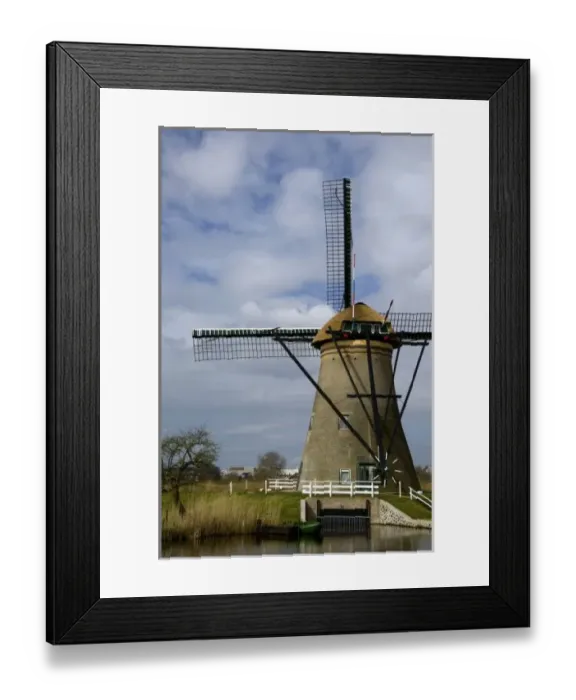 Framed Print : Netherlands (aka Holland), Kinderdijk. 19 historic windmills situated at the convergence Framed Print : Netherlands (aka Holland), Kinderdijk. 19 historic windmills situated at the convergence