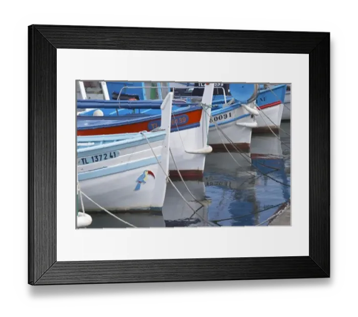 Framed Print : Typical Provencal fishing boats painted in bright colours white, blue, green red yellow Framed Print : Typical Provencal fishing boats painted in bright colours white, blue, green red yellow