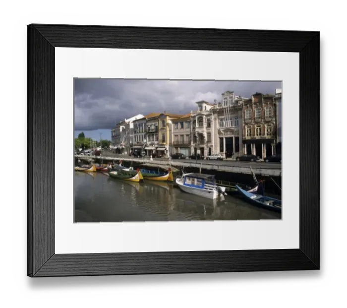 Framed Print : Portugal, Aveiro. Moliceiros (seaweed collecting boats) moored along the Canal Central Framed Print : Portugal, Aveiro. Moliceiros (seaweed collecting boats) moored along the Canal Central