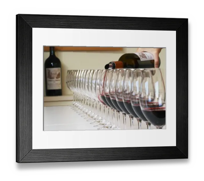 Framed Print : A straight row of glasses lined up for tasting being filled up with red wine - Chateau Framed Print : A straight row of glasses lined up for tasting being filled up with red wine - Chateau