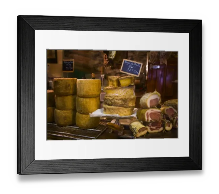 Framed Print : France, Corsica. Local cheeses and charcuterie (cured meats) at shop in Calvi offering Framed Print : France, Corsica. Local cheeses and charcuterie (cured meats) at shop in Calvi offering