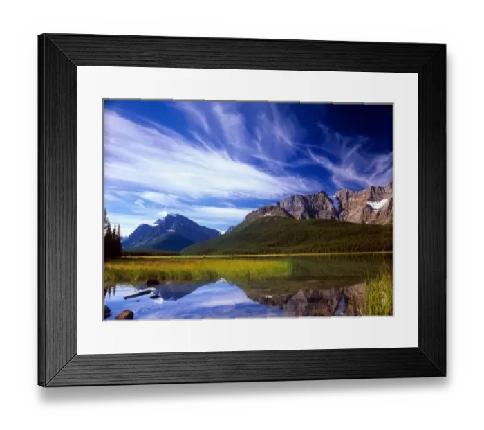 Framed Print : The still waters of Waterfowl Lake make a perfect reflection of a dramatic blue sky