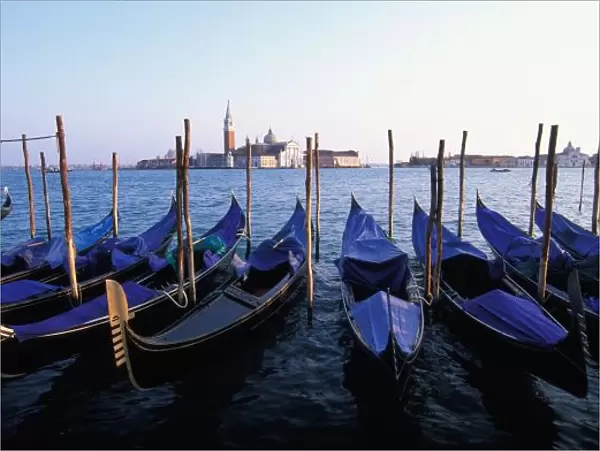 Italy, Veneto, Venice, Row of Gondolas and San Giorgio Maggiore