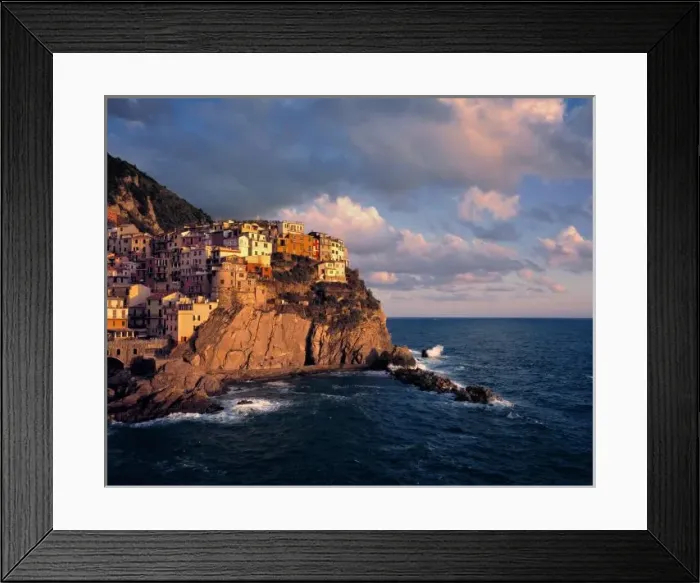 Framed Print : Europe, Italy, Manarola. The cliff-nestled houses of Manarola look over the waves