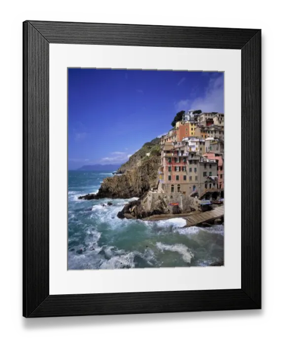 Framed Print : Europe, Italy, Riomaggiore. Riomaggiore is built on steep cliffs and the waves crash Framed Print : Europe, Italy, Riomaggiore. Riomaggiore is built on steep cliffs and the waves crash