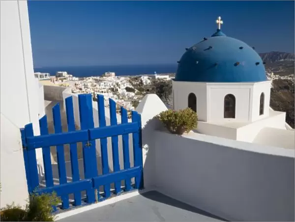 Greece and Greek Island of Santorini from the small town of Imerovigli with blue